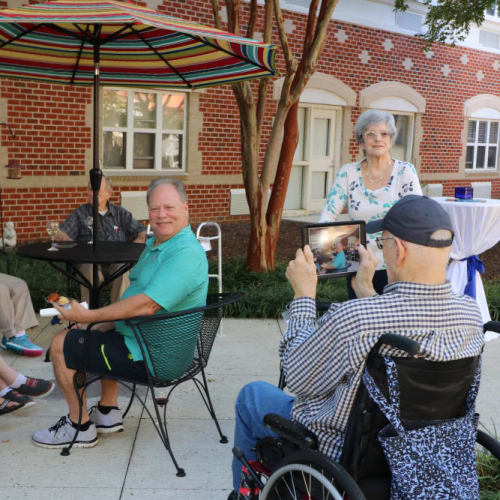 Residents enjoying time on the porch at The Crossings at Ironbridge in Chester, Virginia