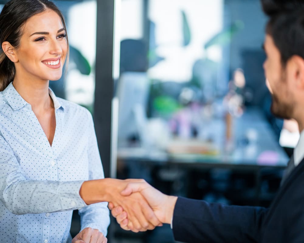 A job seeker shaking hands with the hiring manager at STOR-N-LOCK Self Storage