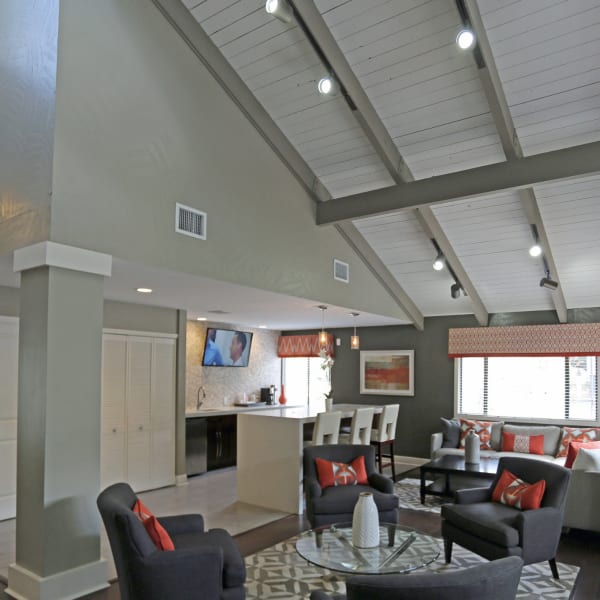 Seating under huge ceilings in the resident clubhouse lounge at Palencia Apartments in Tampa, Florida