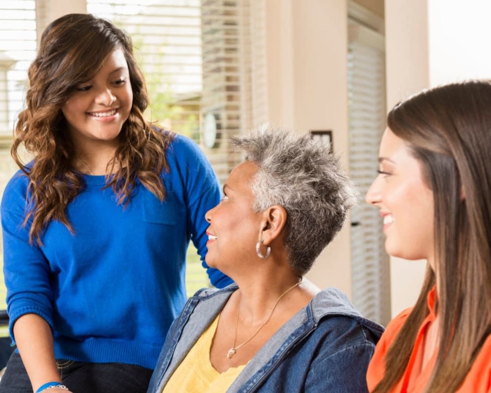 Family comes to visit a resident in assisted living at Milestone Senior Living Woodruff in Woodruff, Wisconsin.