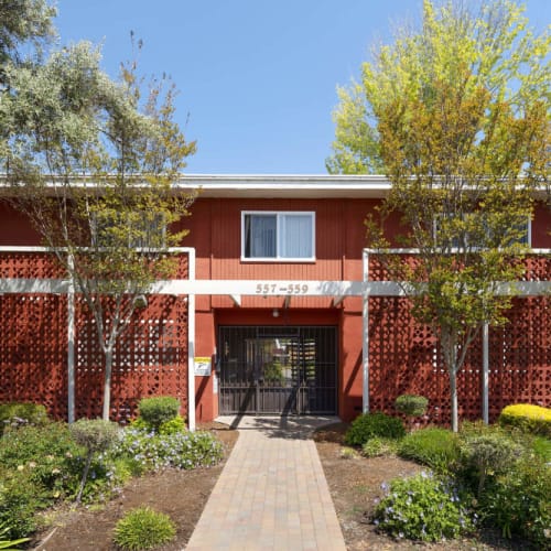 Apartment exterior entrance with gate at Garden Court Apartments in Alameda, California