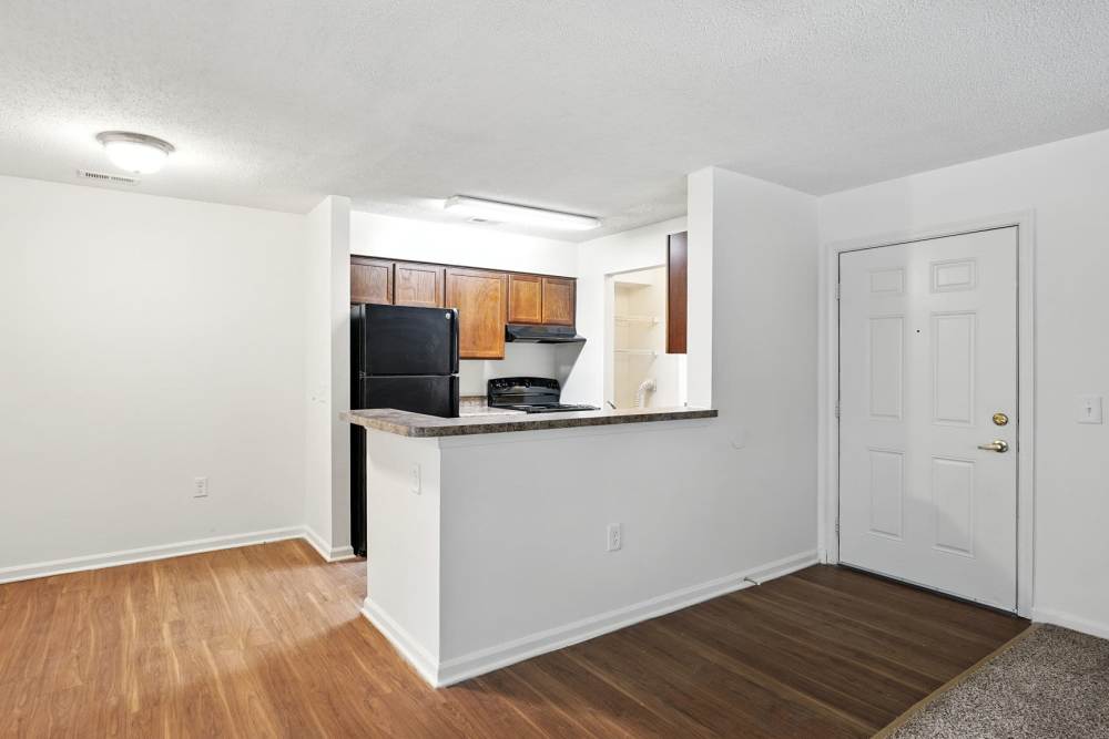 Kitchen with wood-style flooring at Monmouth Woods in King George,Virginia