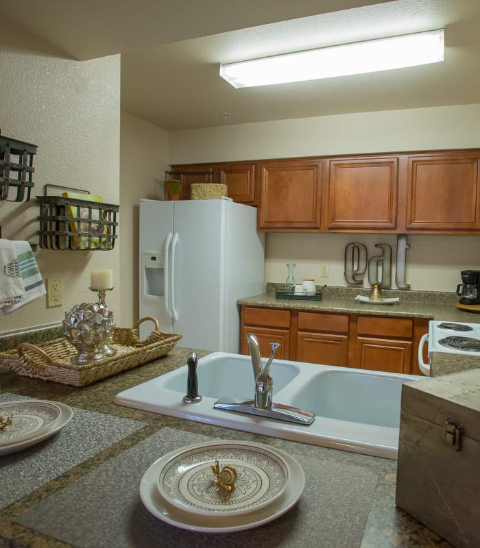 Kitchen with granite countertops at Villas of Waterford Apartments in Wichita, Kansas