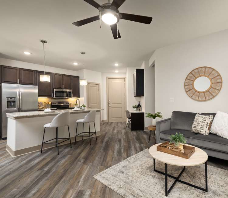 Model living room and kitchen at Villas at the Rim
