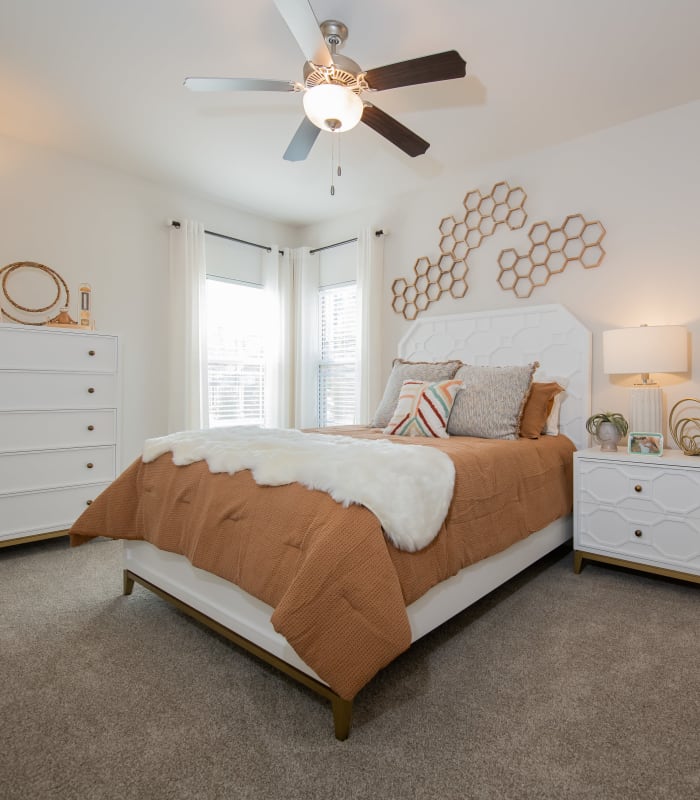 Spacious carpeted bedroom at Artisan Crossing in Norman, Oklahoma