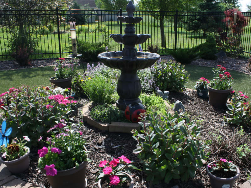 Elegant fountain and foliage at HeatherWood Assisted Living & Memory Care in Eau Claire, Wisconsin. 