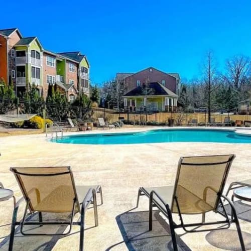 Lounge chairs by the pool at Crossings of Opelika in Opelika, Alabama
