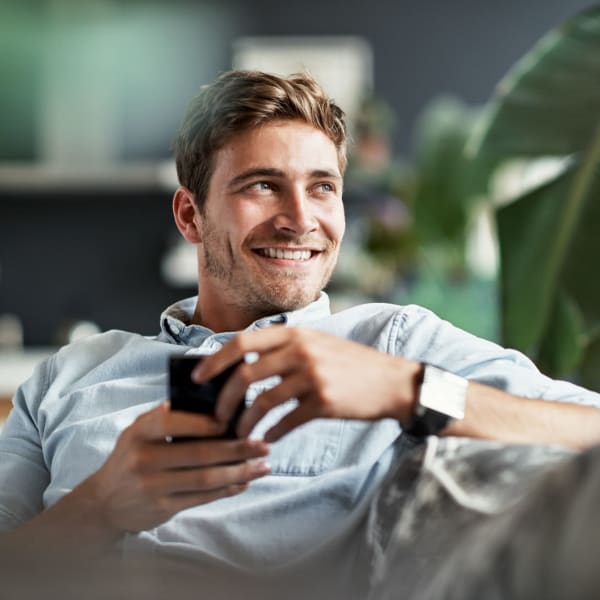 A resident smiles in his apartment at Rockwood Park, Richmond, Virginia