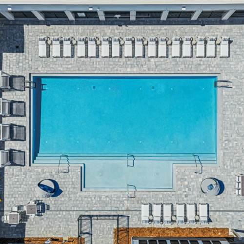 Evergreen-westside-apartments-gainsville-florida-new-apartment-community-pool-with-seating (Large)