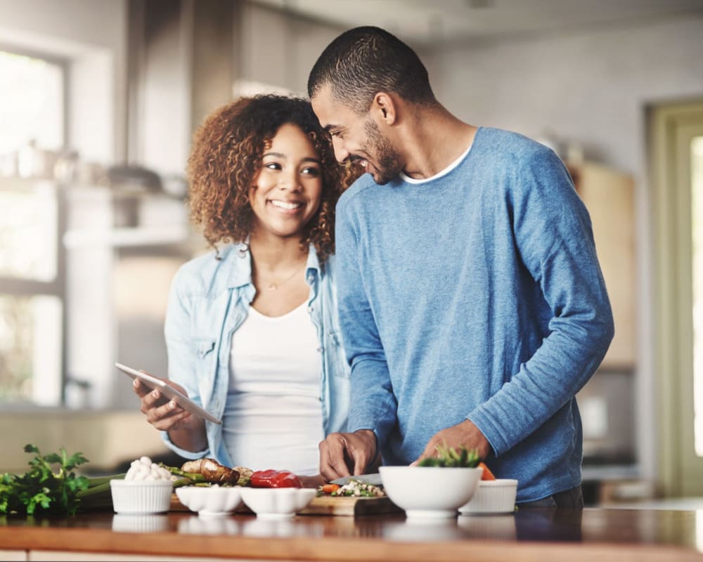 Residents chatting while cooking at home Skyline Redmond in Redmond, Washington