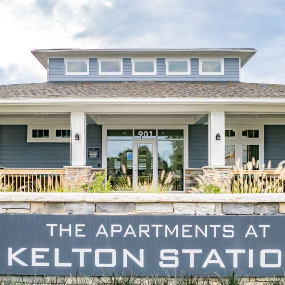 Modern apartment community entrance with welcoming design at The Apartments At Kelton Station in Williamsburg, Virginia