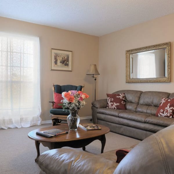 Senior apartment living room at Quail Park of Granbury in Granbury, Texas