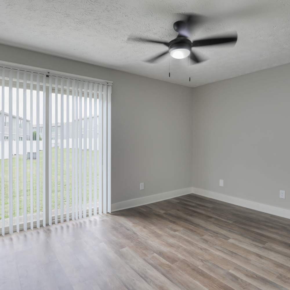 Unfurnished bedroom with full height window at Village Lake Townhomes in Smyrna, Tennessee