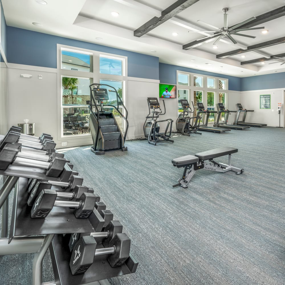 Fitness center with weights and treadmills at Novo Kendall Town in Jacksonville, Florida