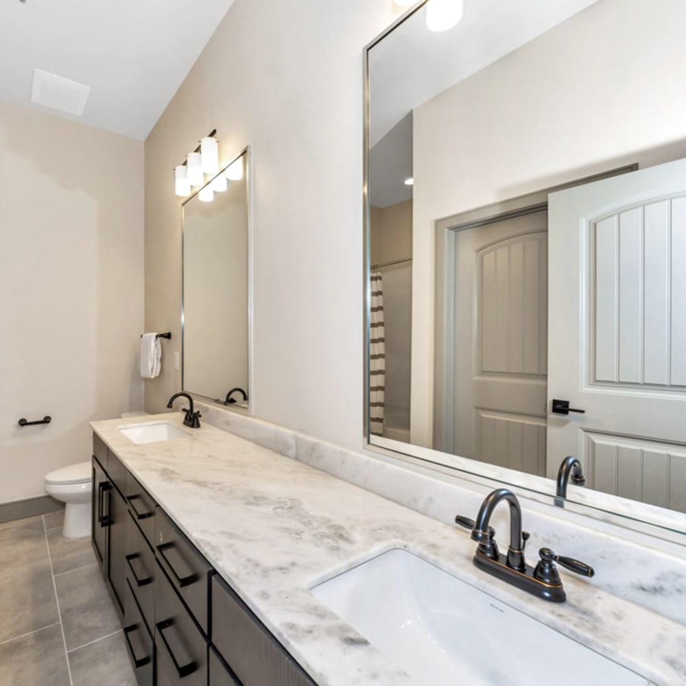 Bathroom of an apartment home at Village at Rayzor Ranch in Denton, Texas