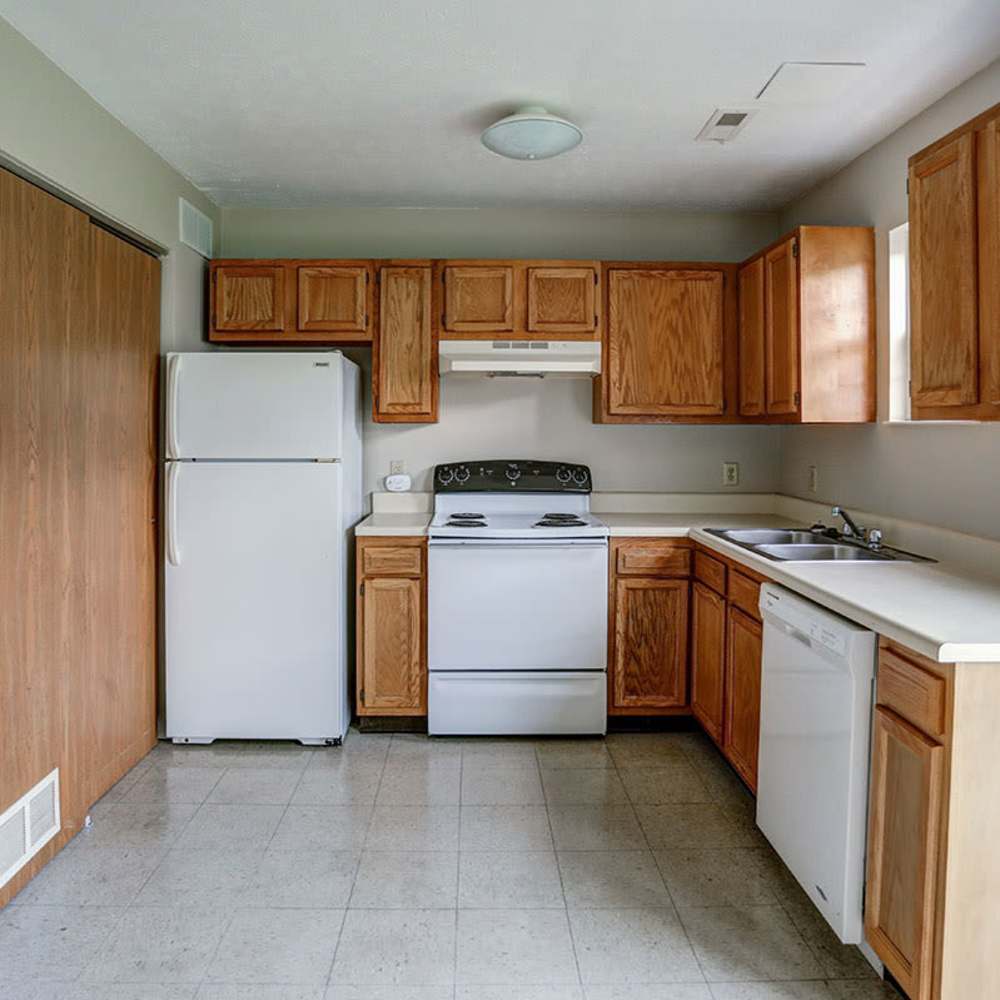 White refrigerator and wooden cabinets at Apple Glen in Van Wert, Ohio