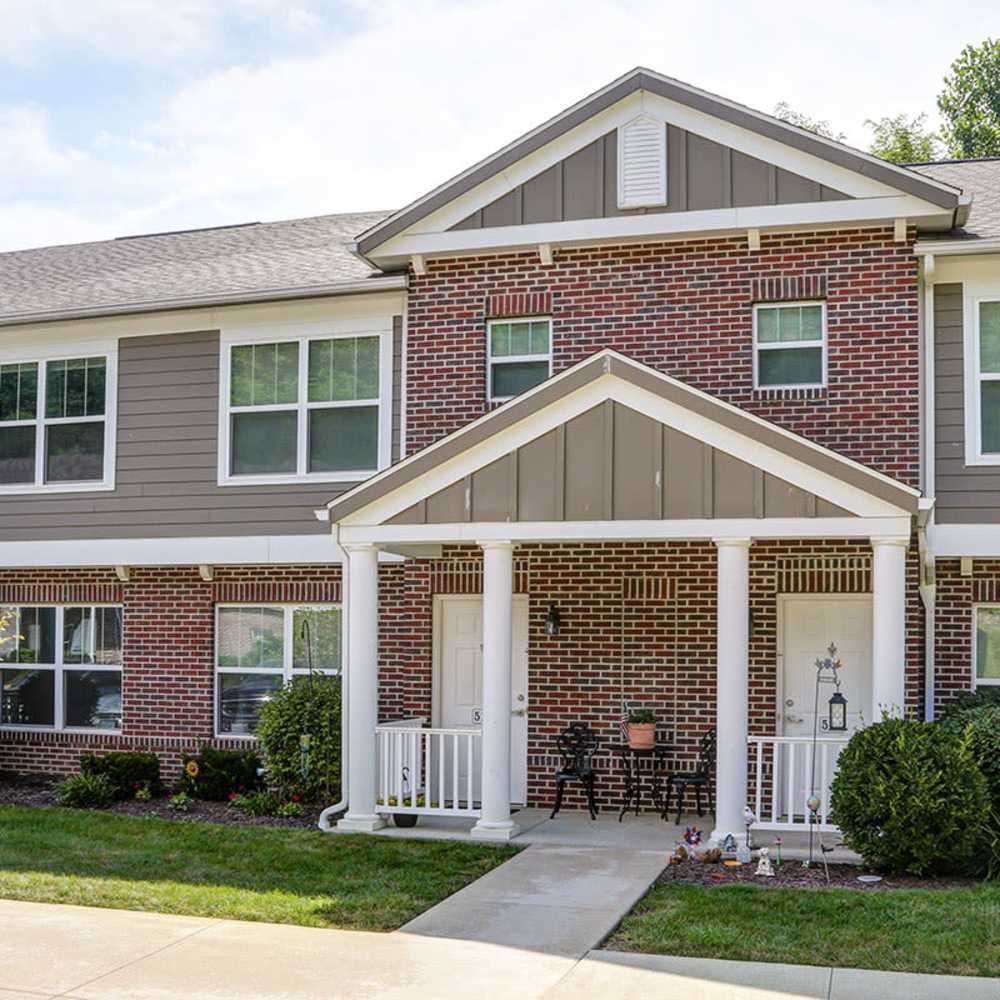 Brick exterior with white columns and porch at Autumn Run in Millersburg, Ohio