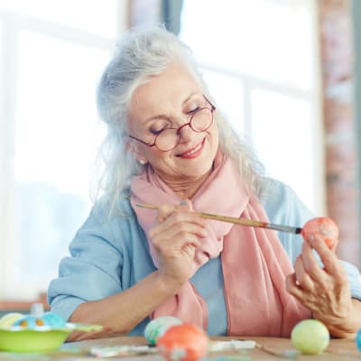 Resident Decorating an easter egg at York Gardens in Edina, Minnesota