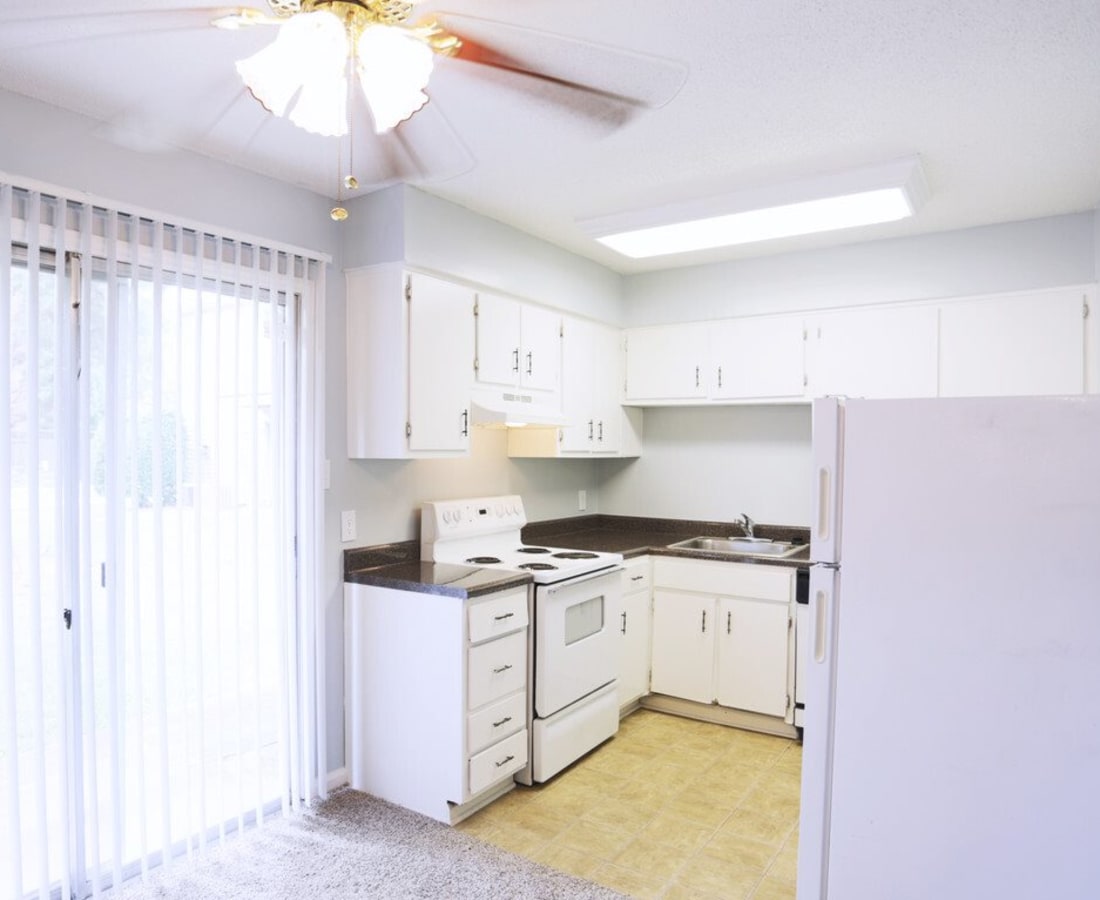 A bright kitchen with a ceiling fan at Meadowbrook and Brookridge in Charlotte, North Carolina