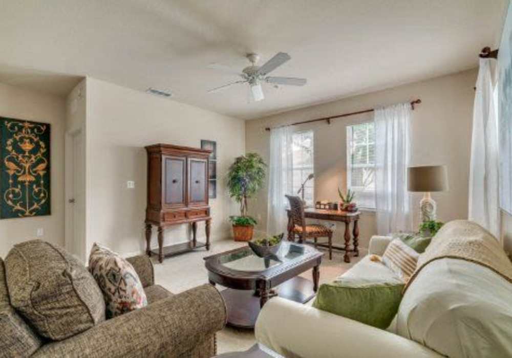 Stylish living room with neutral color palette at Victoria Park Apartments in Davenport, Florida