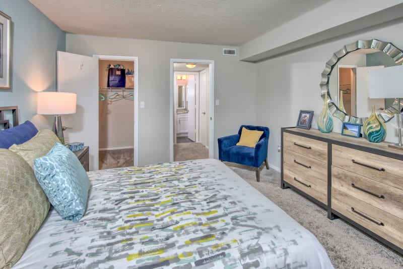 Well lit model bedroom and spacious closet for storage at The Madison in Charlotte, North Carolina