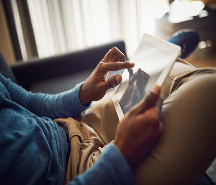 resident working on a tablet at Corner on Main in Jacksonville, Florida