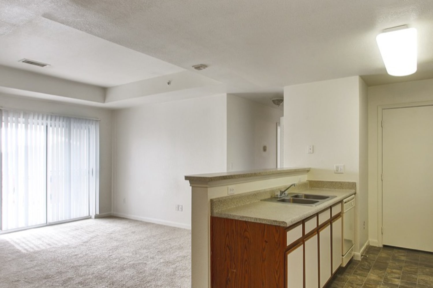 Living Room & Kitchen at Sterling Park Apartments in Brighton, Colorado