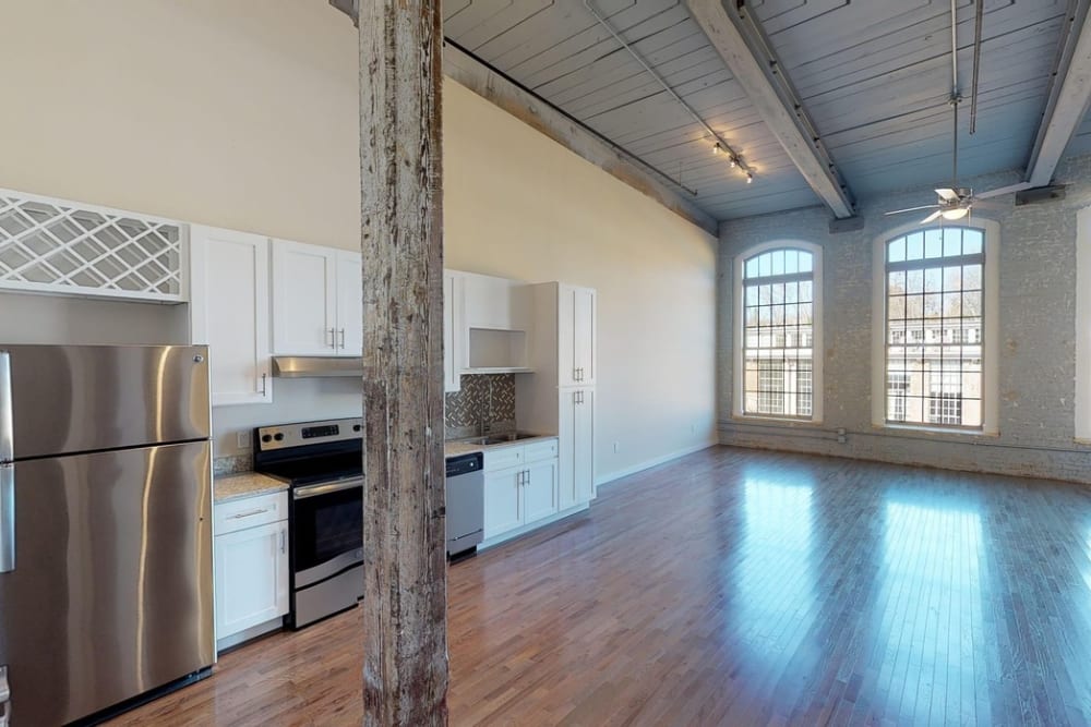 Stainless-steel appliances in an open kitchen at Bellevue Mill in Hillsborough, North Carolina