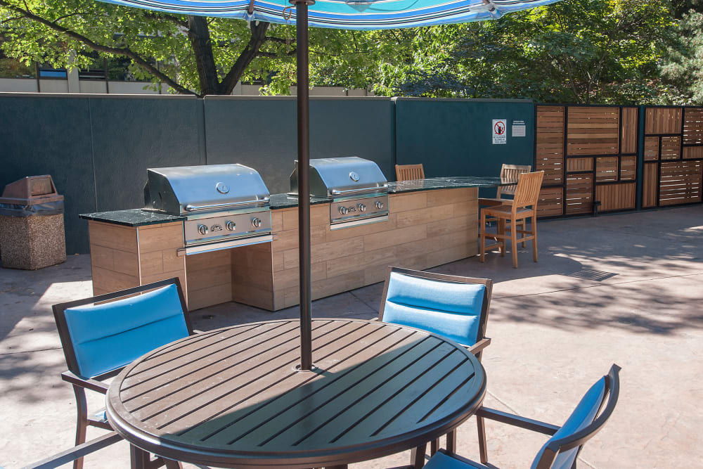 Picnic tables with umbrellas for sun coverage at The Mill at First Hill in Seattle, Washington