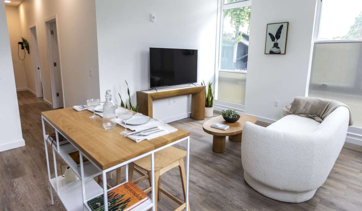 Open living and dining area with natural light at Brookland Apartments in Portland, Oregon