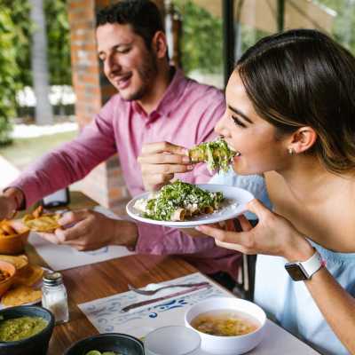 Residents enjoying the dining at a restaurant near The Ideal in Madison, Wisconsin