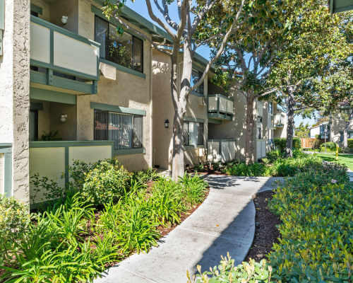 A beautifully landscaped pathway at Pebble Creek Apartment Homes, Campbell, California