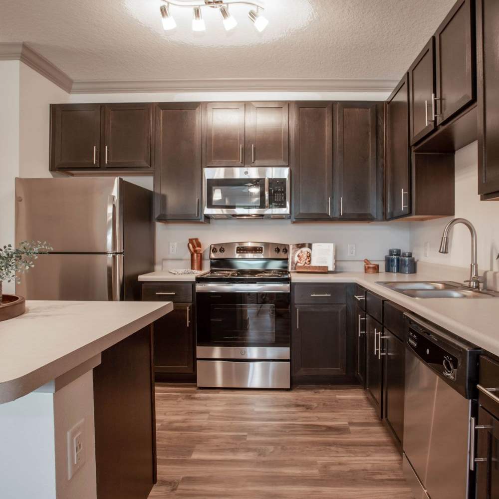 Kitchen with wooden cabinets at Glades at Gulf View in Port Richey,Florida