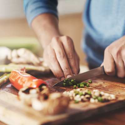 A resident prepares a fresh meal in his kitchen at Vintage at the Avenue, Murfreesboro, Tennessee