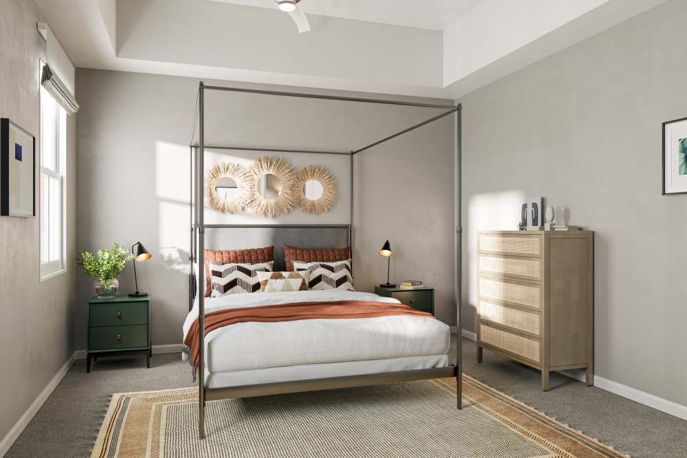 Modern vibrant bedroom with carpet and side table at Argent Cottages in Hardeeville, South Carolina