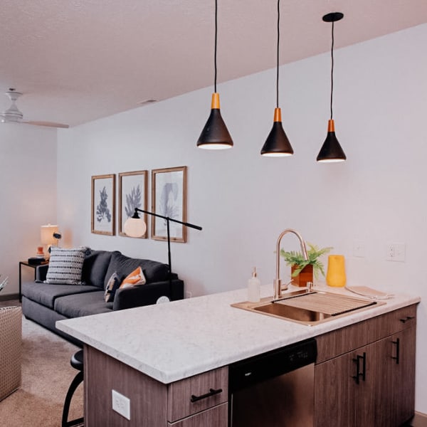 Apartment kitchen island with a sink built into it at The Laurel Flats in Crawfordsville, Indiana