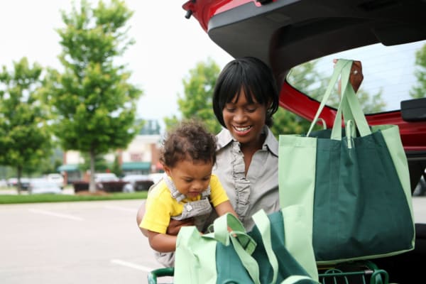 A resident loading groceries into her car near Magnolia Gardens in Brookhaven, Georgia