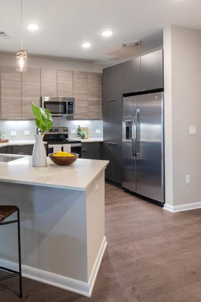 Model kitchen with wood flooring The Jade at Avondale in Decatur, Georgia
