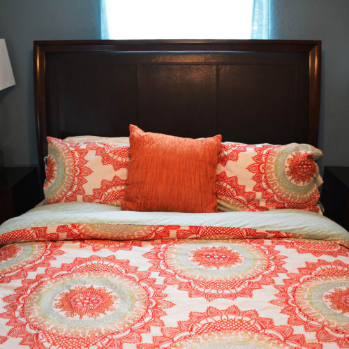 Comfy bed at The Abbey at Champions apartments