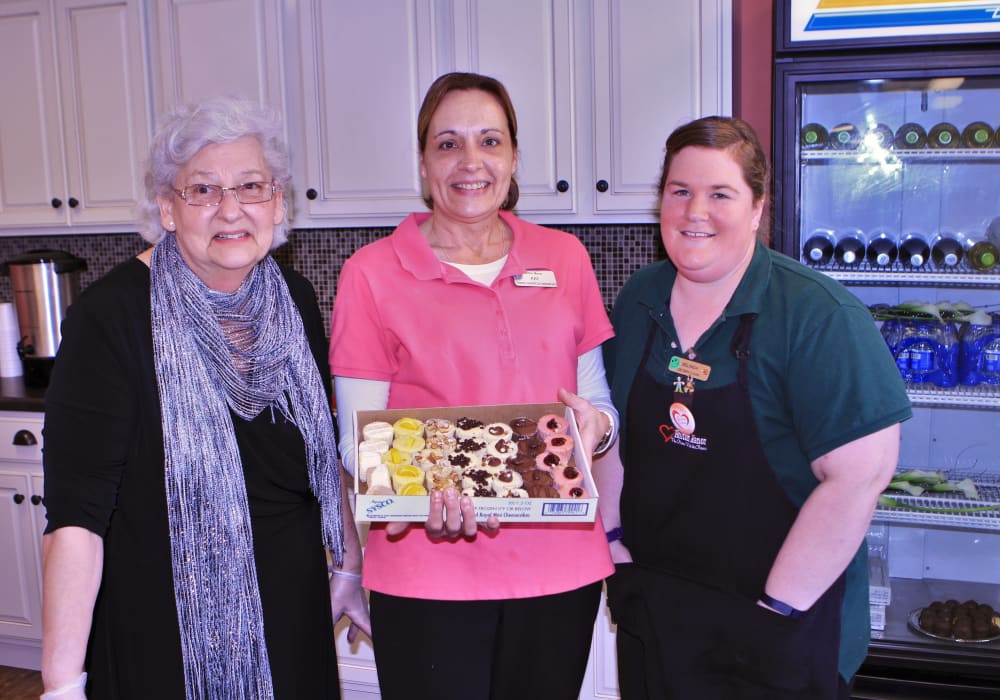 Staff holding baked goods for residents at Holton Manor in Elkhorn, Wisconsin