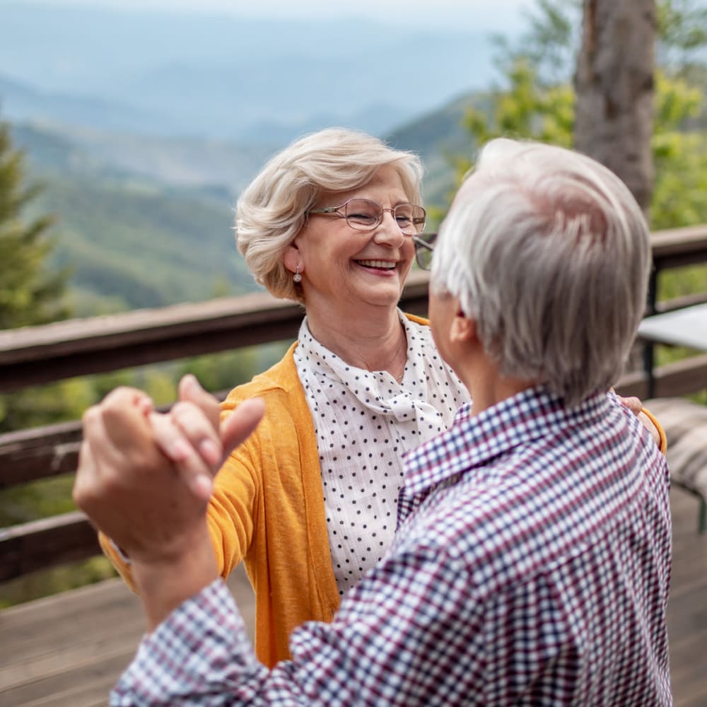 Two people dancing at a Ridgeline Management Company senior living property 