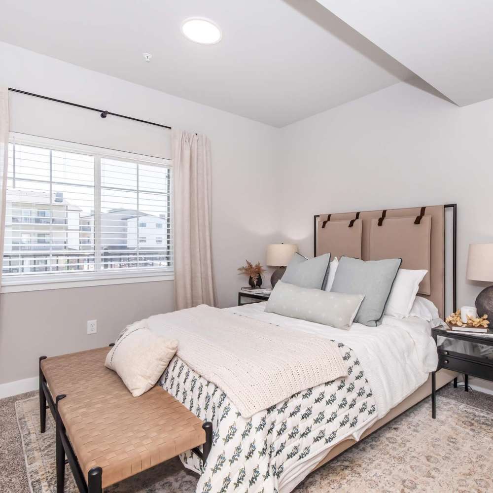 Comfortable bedroom with king size bed and large window at InterUrban 2.0 in Billings, Montana