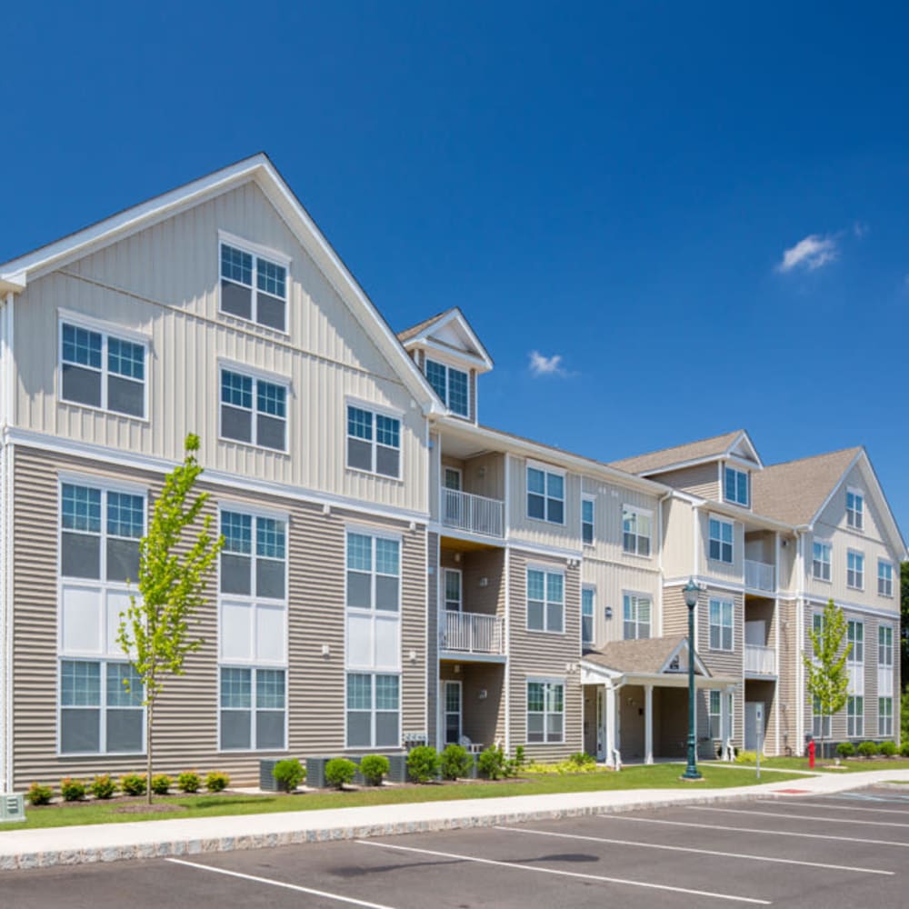 Exterior view of the community with parking spaces at Grove at Somerset in Somerset, New Jersey