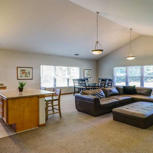 Clubhouse with sectional sofa at Harmony Greene in Pooler, Georgia
