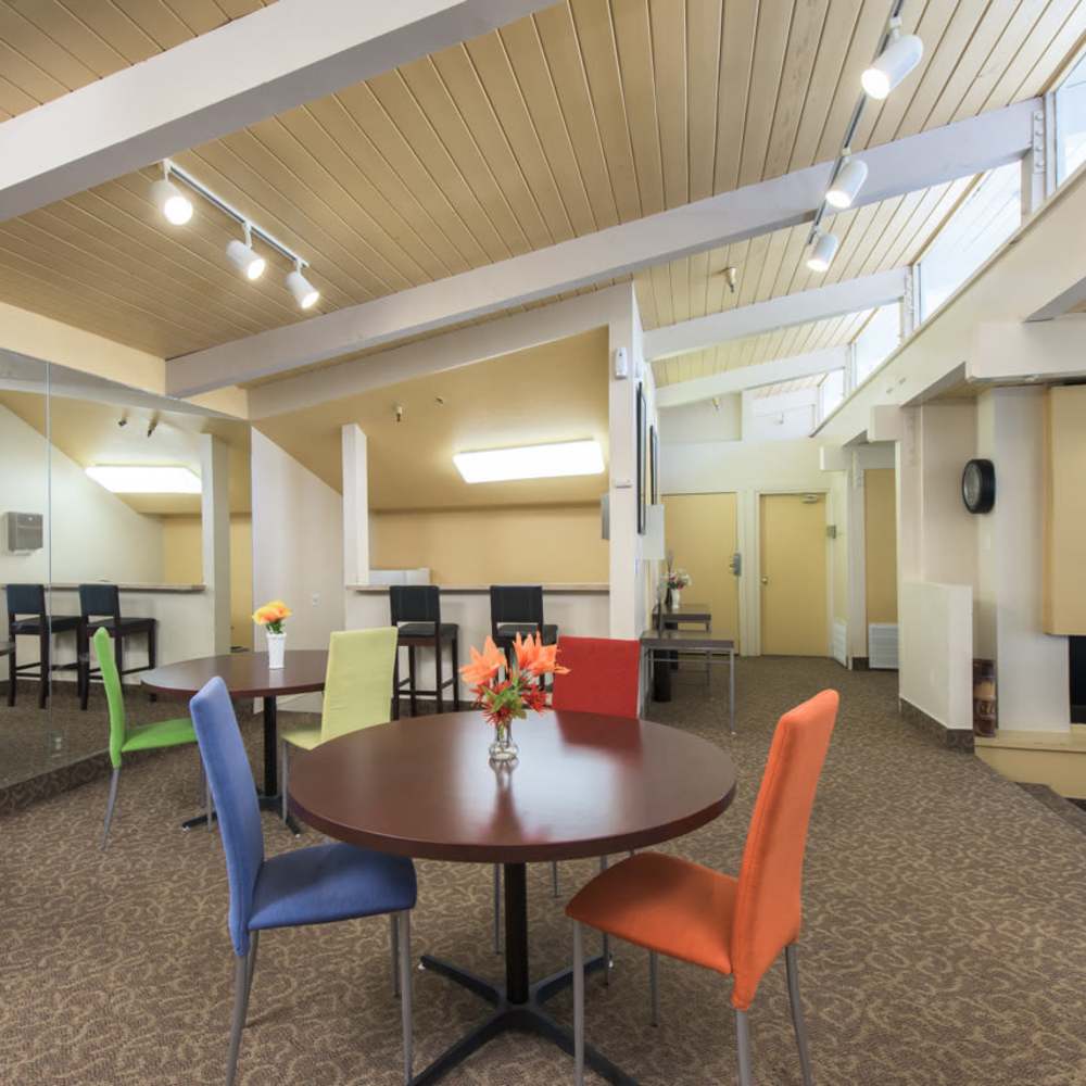 Dining area with multiple tables and chairs at Tarzana Springs in Tarzana, California