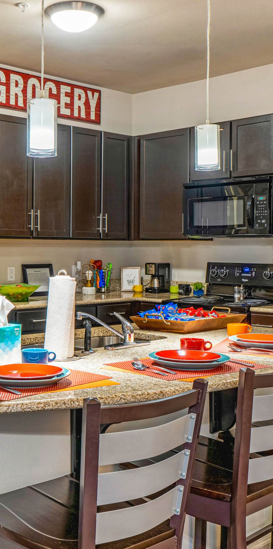 Modern kitchen in a model student apartment at The Den in Columbia, Missouri