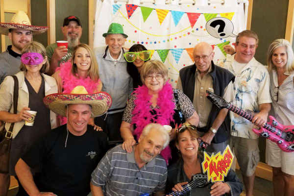 Resident and family enjoying a party at Merrill Gardens at Renton Centre in Renton, Washington. 