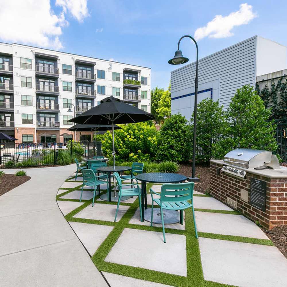 Outdoor patio area with grilling stations at Siena Suwanee Town Center in Suwanee, Georgia