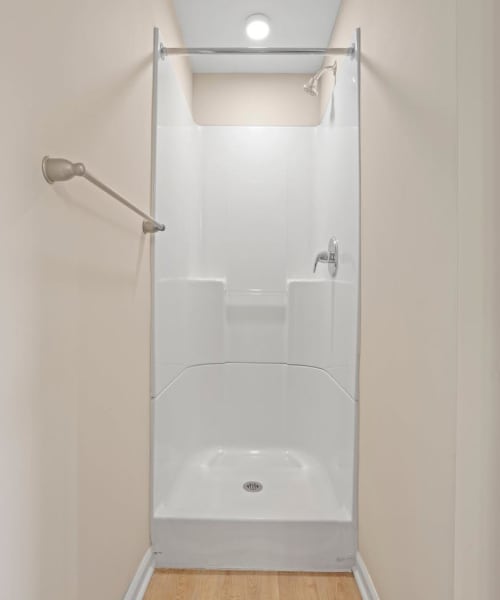 Walk-in shower of the apartment home at Kershaw Greene III in Athens, Ohio