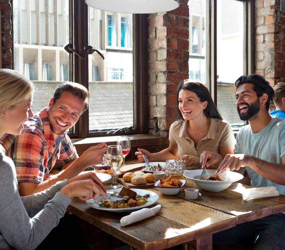 A group of friends out at a restaurant near Advantage Self Storage in Louisville, Colorado